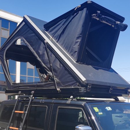Upgraded triangular tent with skylight on the outer shell